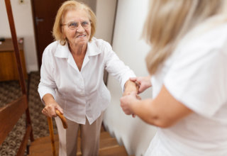 A caregiver giving assistance to her patient